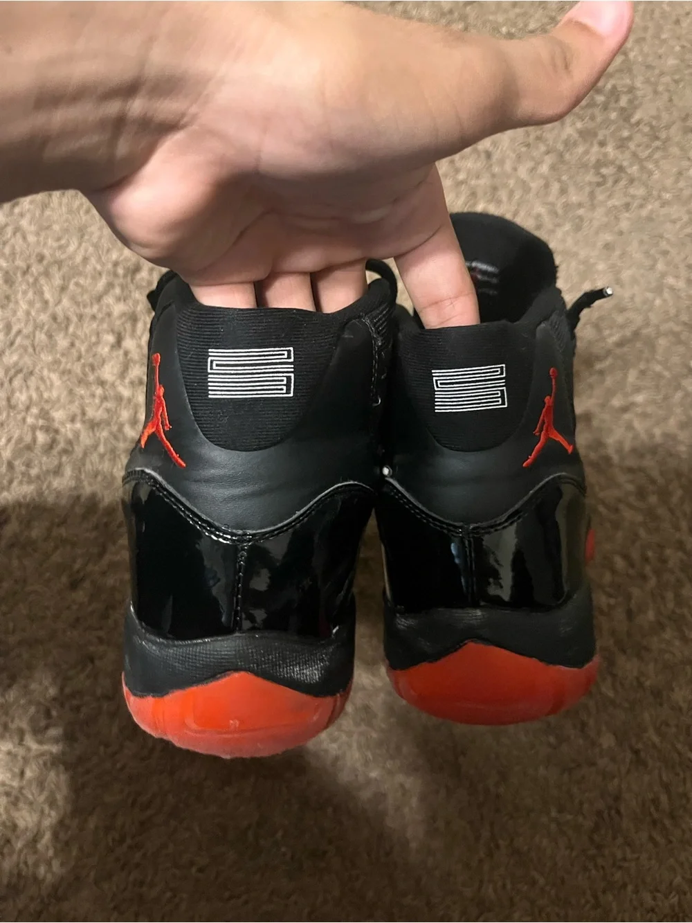 Jordan 11s breds with custom black part,Men’s Black and Red Retro-Style Sneakers